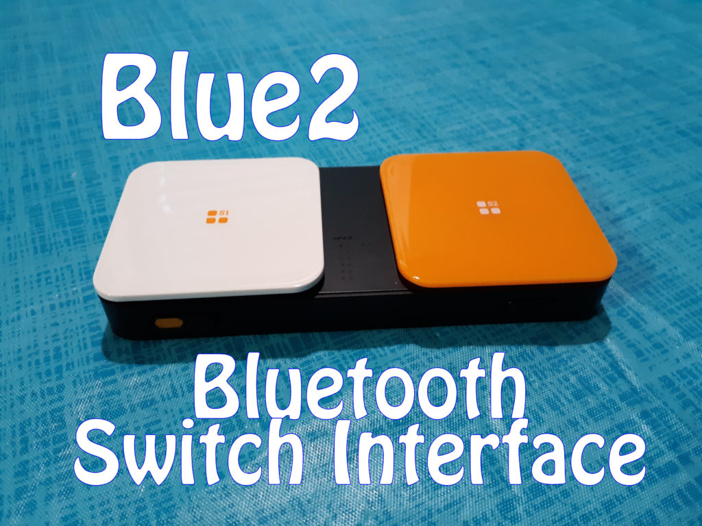 Today on Accessibility Hardware we're discussing the Blue2 Bluetooth Switch Interface. Seen is the interface on a table showing off its white and orange switches.
